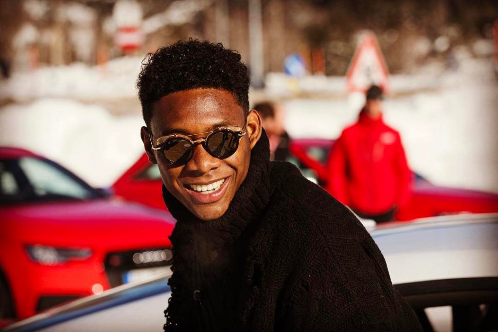 David Alaba wearing a street style outfit with fashionable sunglasses