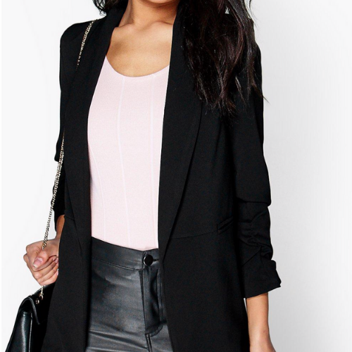 Woman wearing a long black blazer