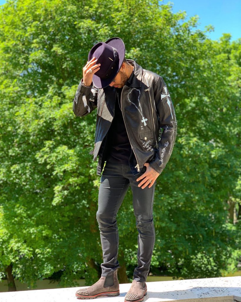 Neymar in a street style outfit featuring a leather jacket
