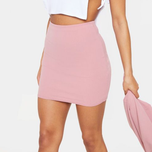 Women wearing a pink mini skirt