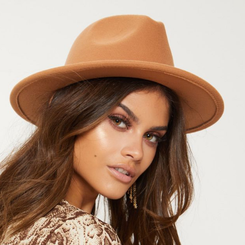 Woman wearing a tan hat