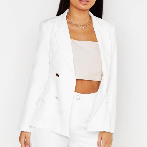 woman wearing a white double breasted blazer