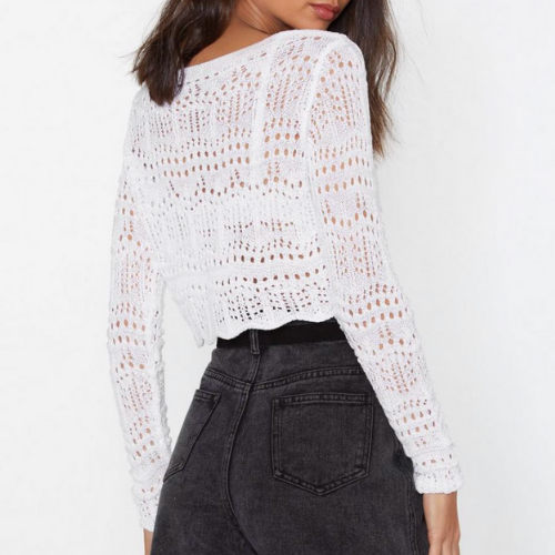 Woman wearing a white crochet lace top